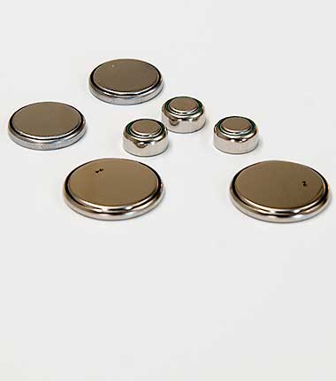 Picture of seven small button cell batteries.